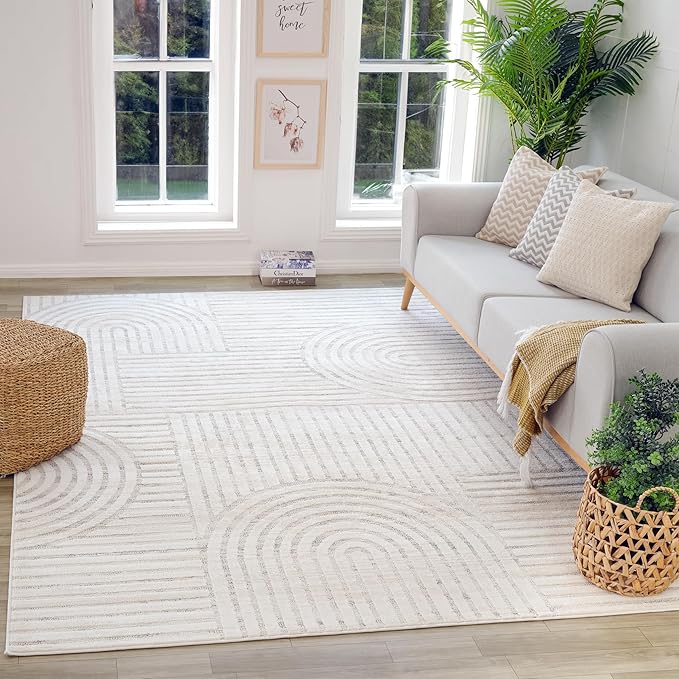 Modern living room with white patterned rug.