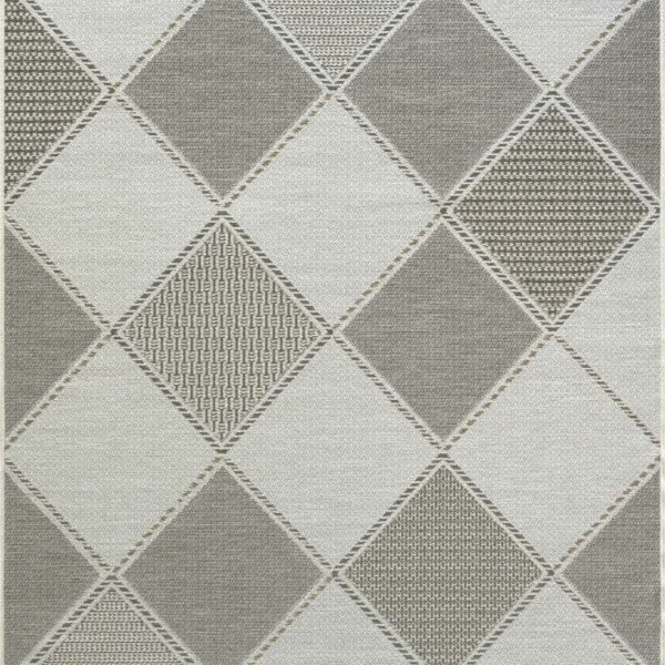 Geometric diamond pattern in neutral colors on fabric.