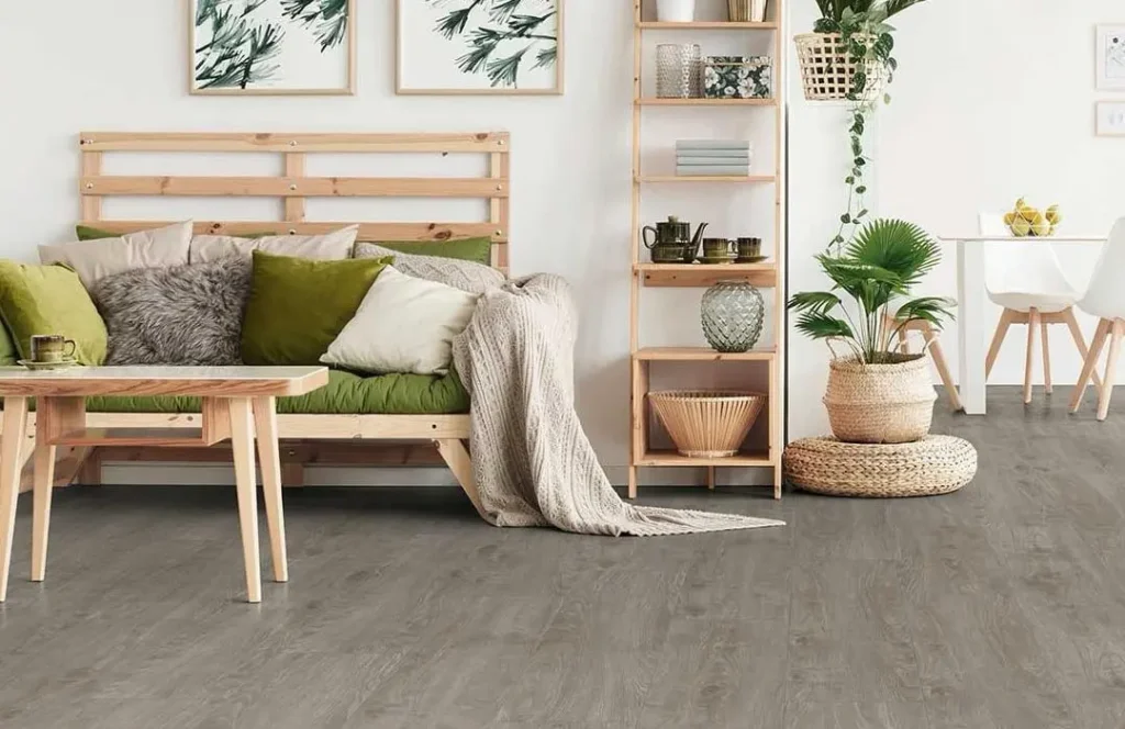 Cozy living room with plants and wooden furniture.