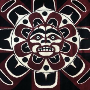Aztec-style sun face with intricate patterns