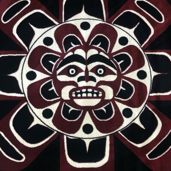 Aztec-style sun face with intricate patterns