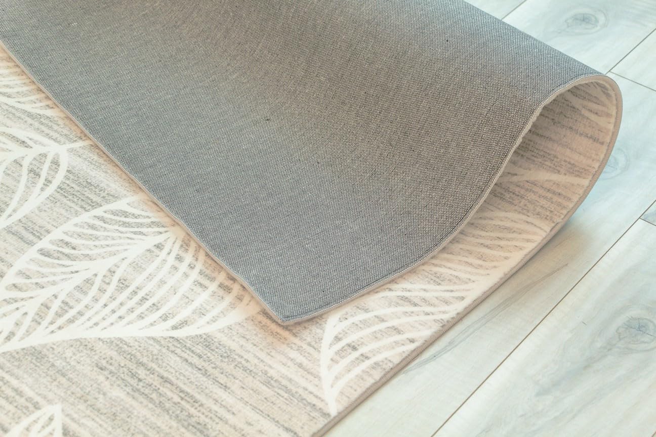 Corner of rug on wooden floor