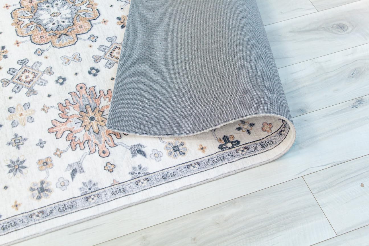 Rolled decorative rug on light wood floor.