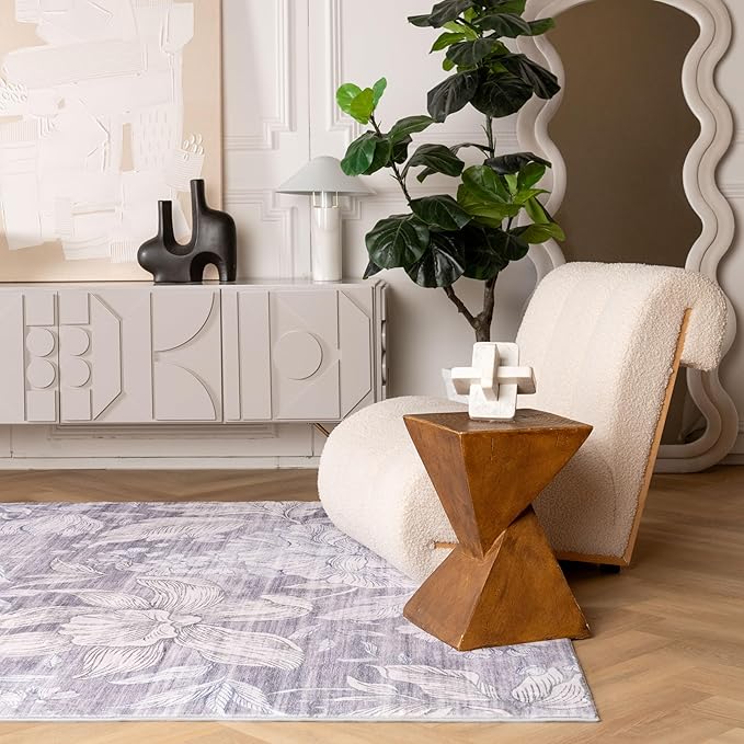 Modern living room with chair and decorative elements.