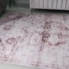 Vintage pink-patterned rug in living room