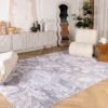 Modern living room with elegant floral-patterned rug.