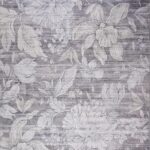 Intricate floral pattern on gray wallpaper background.