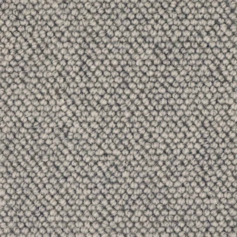 Close-up of gray textured carpet fabric
