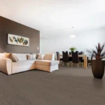 Modern living room with beige couch and dining area.