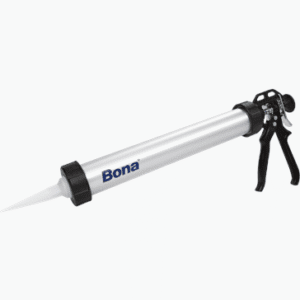 Caulking gun with silver barrel and black handle.