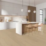 Modern kitchen with island and pendant lights.