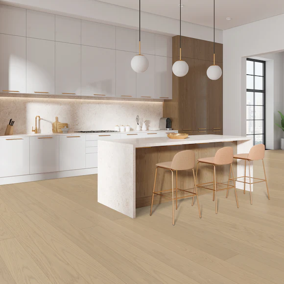 Modern kitchen with island and pendant lights.