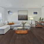 Modern living room with gray sofa and artwork.
