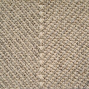 Close-up of textured woven fiber carpet pattern.
