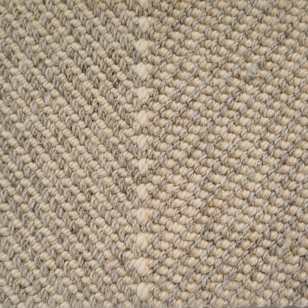 Close-up of textured woven fiber carpet pattern.