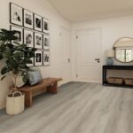 Modern hallway with framed photos and wooden bench.