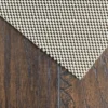 Non-slip rug pad on wooden floor
