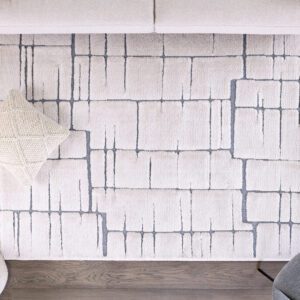 Modern geometric rug, neutral tones, cozy living room.