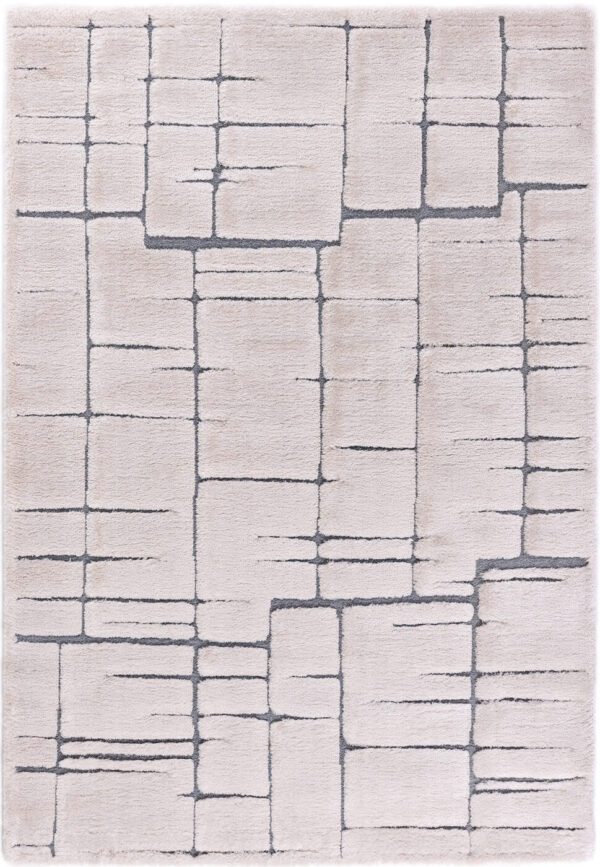 Beige rug with geometric pattern design.