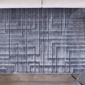 Gray geometric patterned rug on wooden floor