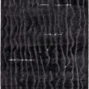 Dark, textured shag rug with a wavy pattern.