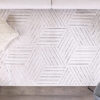 Geometric patterned area rug in modern living room.