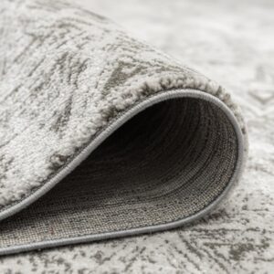Close-up of rolled beige patterned carpet