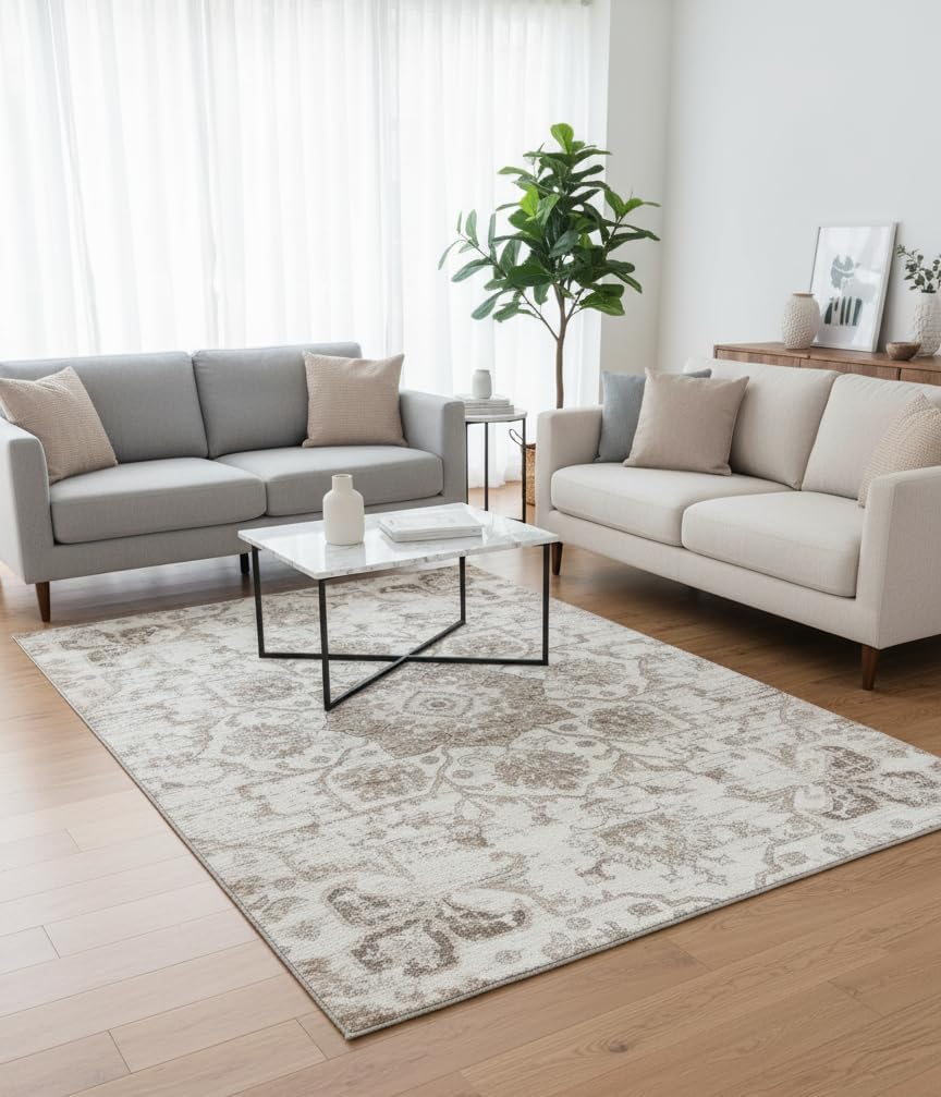 Modern living room with beige sofas and rug.