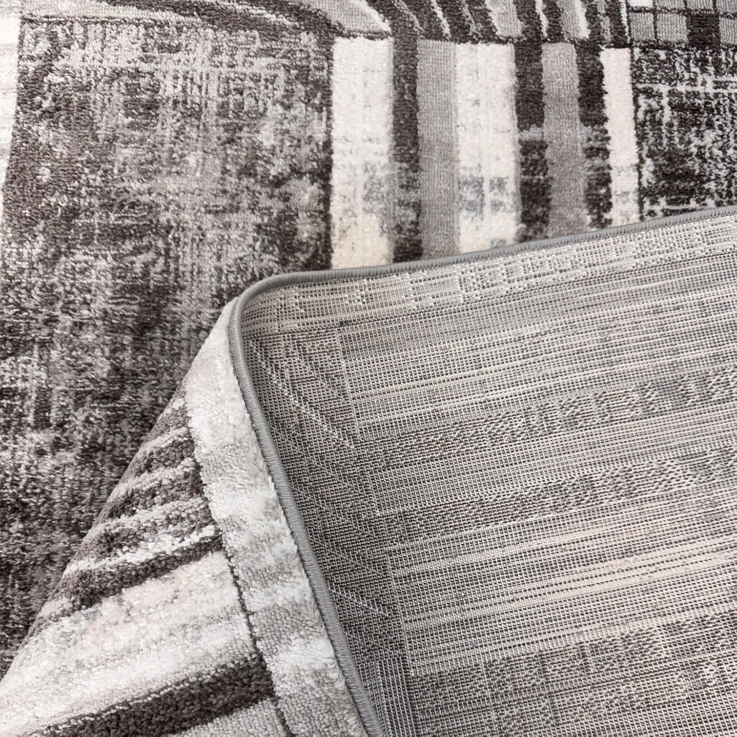 Gray patterned rug with corner lifted