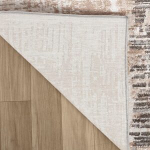 Corner of rug showing underside on wood floor