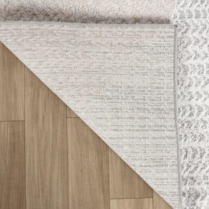 Rug corner folded on wood floor