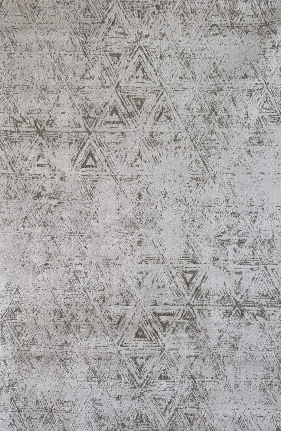 Abstract triangle pattern on textured surface.