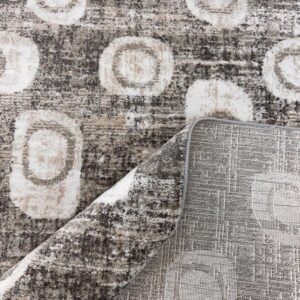 Abstract patterned rug with circles and textures.