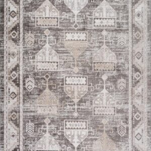 Patterned gray and white area rug with geometric design.