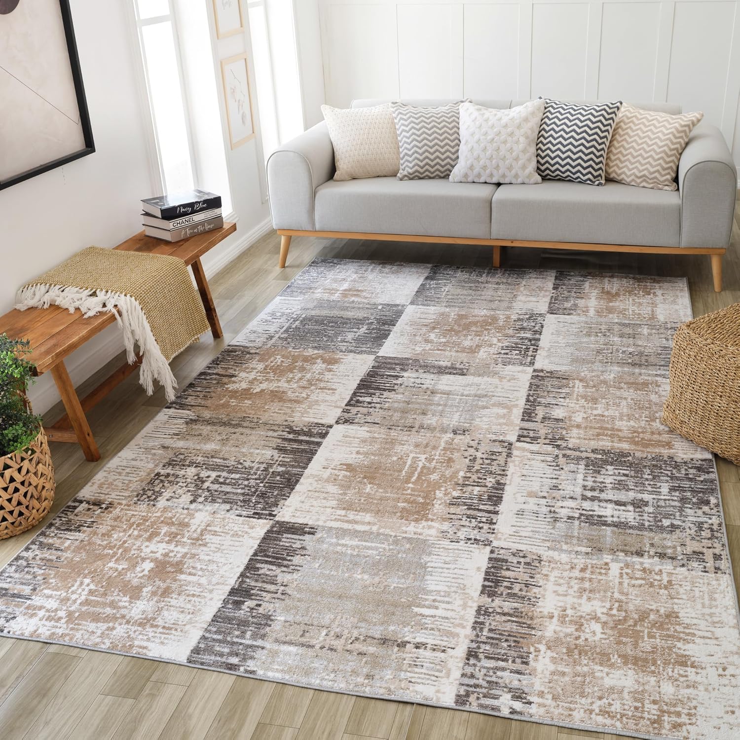 Modern living room with patterned rug and sofa.